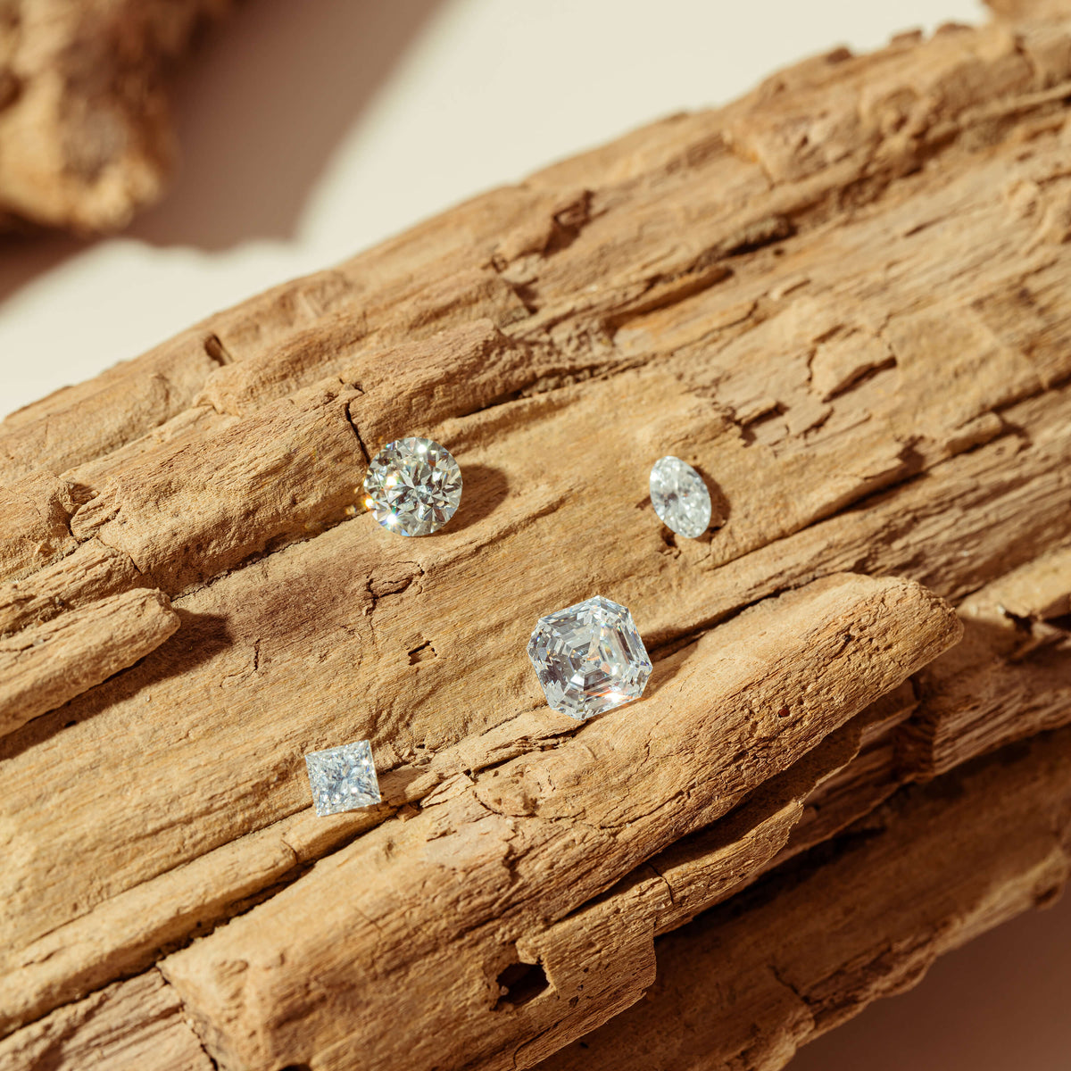Loose reclaimed diamonds on driftwood