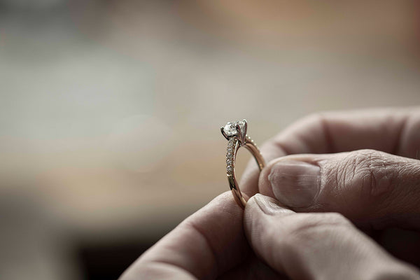 Jeweller holding Reclaimed Diamond Ring