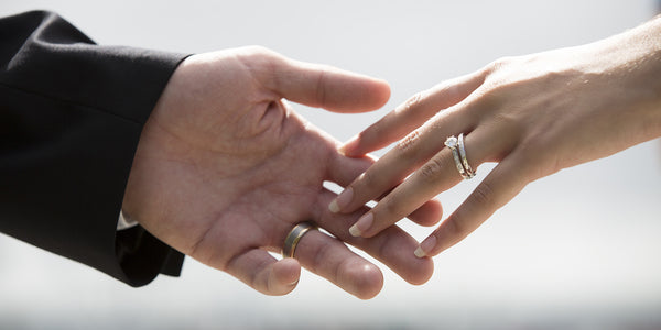 Married couple holding hands