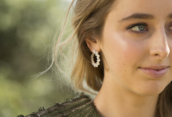 Model wearing diamond earrings