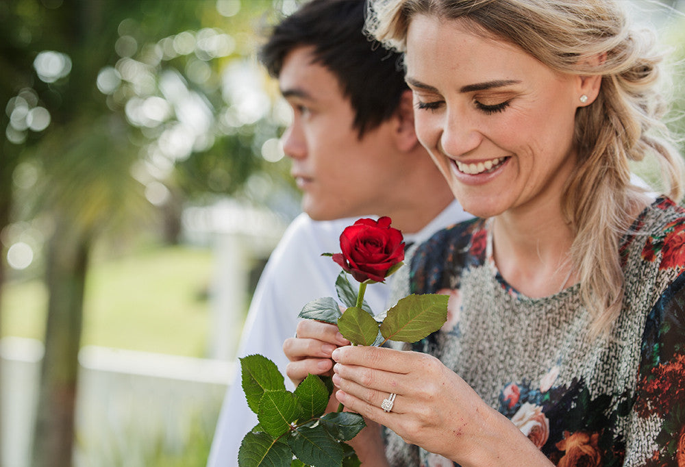 Couple with woman holding flowers