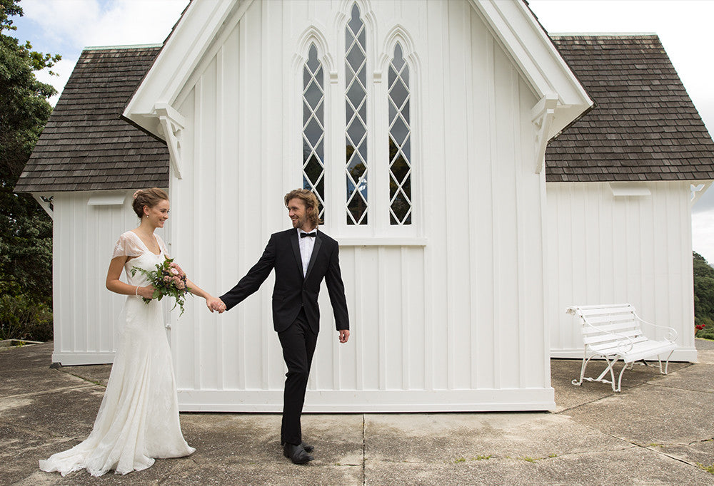Newly married couple in front of a church