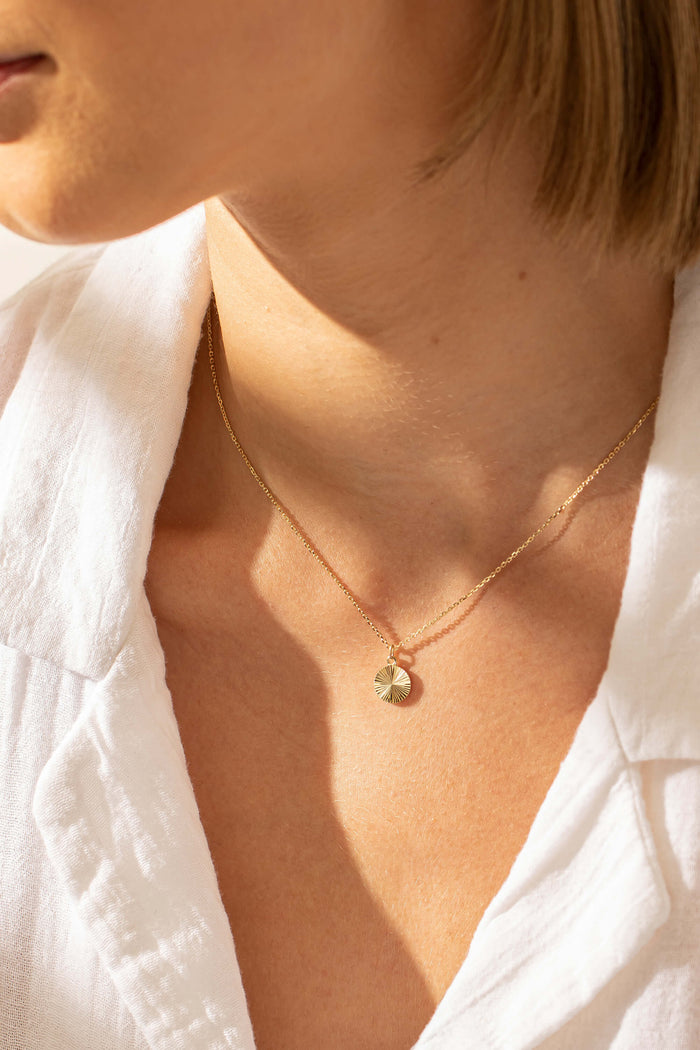 Model wearing Reflections Pendant