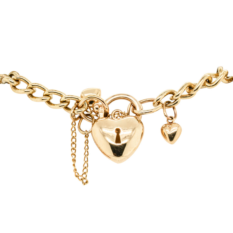 Deja Vu 9ct Yellow Gold Heart Charm Curb Bracelet-Bracelet-Walker & Hall