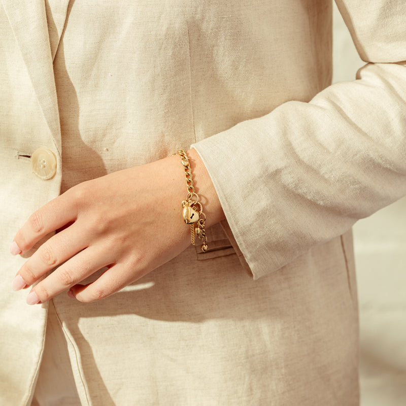 Deja Vu 9ct Yellow Gold Heart Charm Curb Bracelet-Bracelet-Walker & Hall