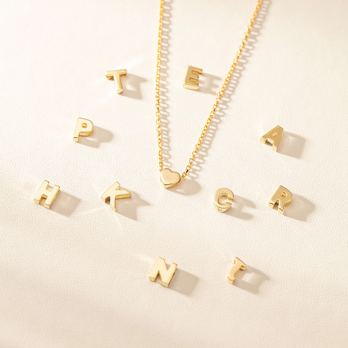 Yellow gold Noted letter pendants