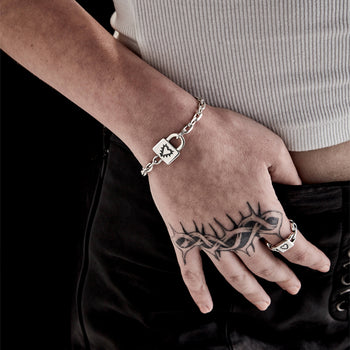 Model wearing Stolen Girlfriends Club Heart Lock Bracelet