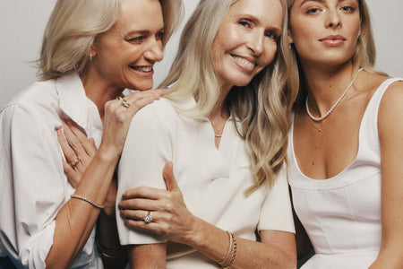 Three generations of women (mother, daughter and granddaughter) wearing natural diamond, pearl and gold jewellery