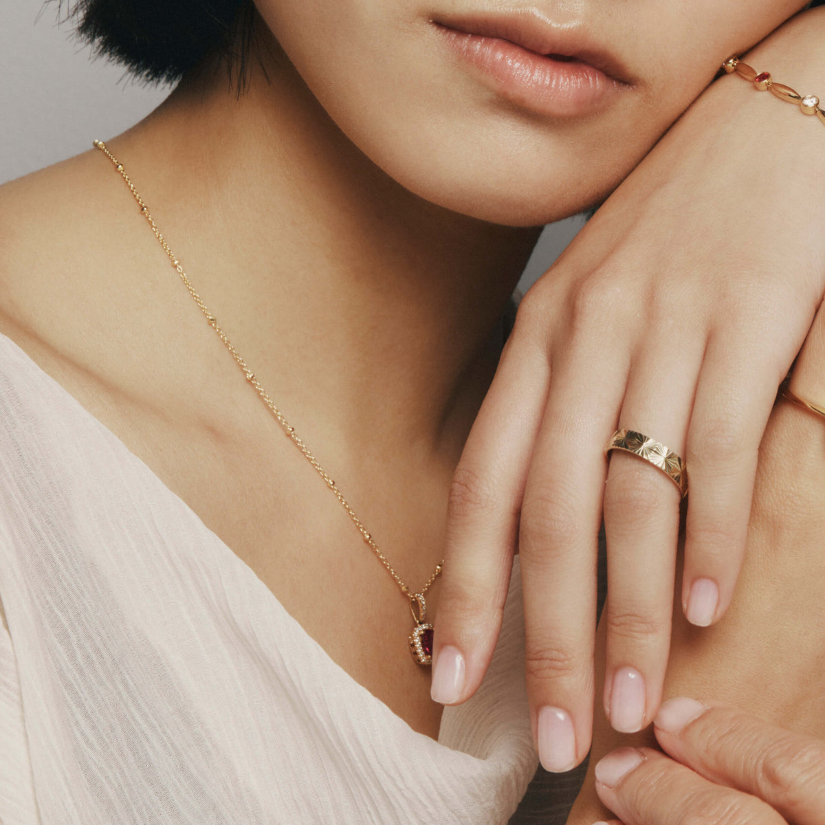 Model wearing gold Reflections Ring
