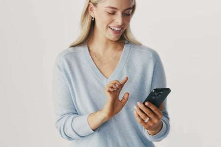 Model using a phone for online shopping